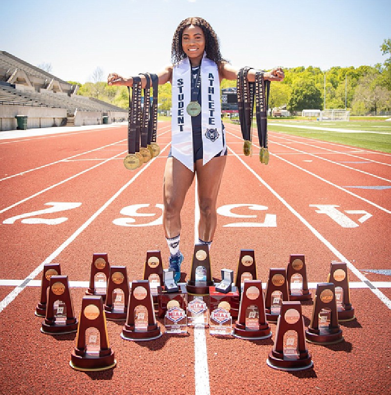 Renea Ambersley shows off some of the awards she's earned as part of multiple championships with the Lincoln University Blue Tigers. Photo courtesy of Keena Lynch/Lincoln University Athletics