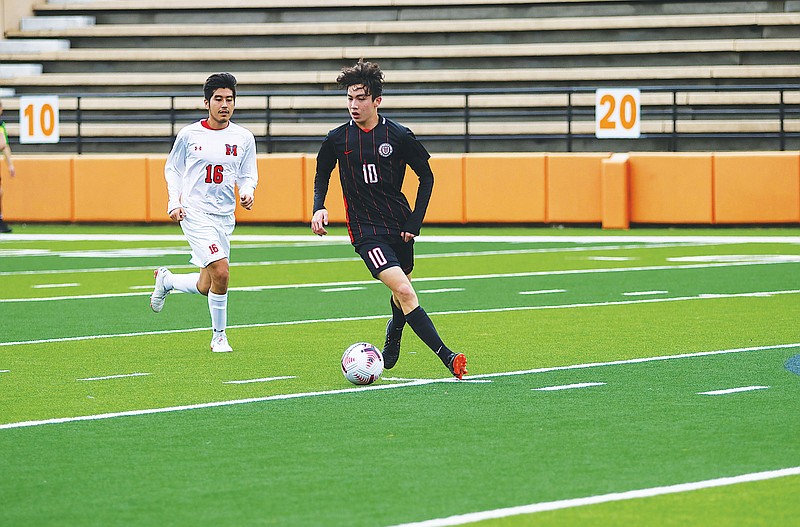 Photo cReece Gaylor, right, dribbles the ball upfield during a game.