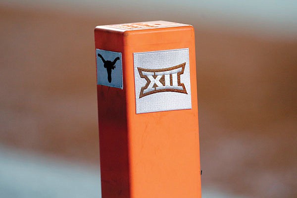 In this Sept. 15, 2018, file photo, the Big 12 conference logo is seen on a pylon during a game between Texas and USC in Austin, Texas.