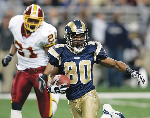 In this Dec. 24, 2006, file photo, Rams receiver Isaac Bruce runs after making a catch during a game against the Redskins during a game in St. Louis.