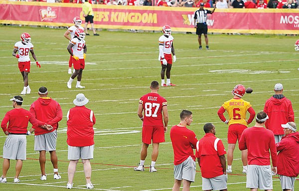 Chiefs tight end Travis Kelce (87) watches from the sideline as teammates run drills Saturday during training camp in St. Joseph.