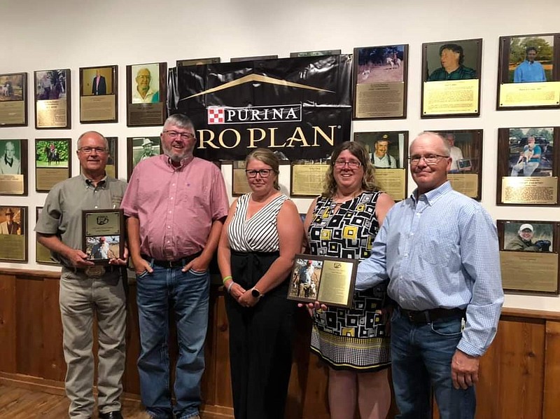 <p>Submitted</p><p>Pictured from left to right are National Bird Hunting Association President Ken Sauer, Kevin Carpenter (son), Laura Sanning (daughter), Tawnya Pace (daughter) and NBHA Secretary Tim Penn. Sauer and Penn presented the Carpenter family with a Hall of Fame award honoring the trio pictured here’s late father, Larry Carpenter.</p>