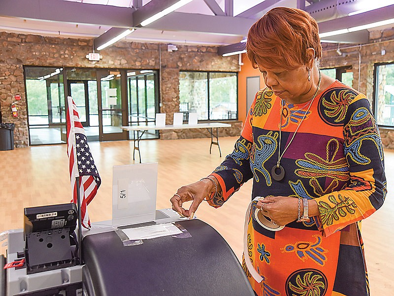 Rev. Vicky Bundy puts out more 'I Voted' stickers Tuesday, Aug. 3, 2021, after finally going through the first batch early in the morning. As predicted, voter turnout was very low but the polling place workers were vigilant about keeping supplies stocked and neat.