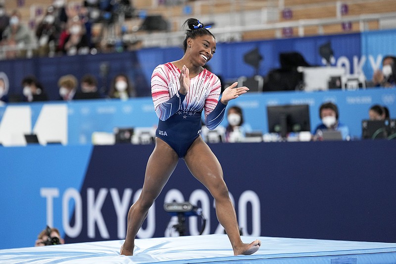Simone Biles of the United States finishes on the balance beam Tuesday during the women's gymnastics apparatus final at the 2020 Summer Olympics in Tokyo.
