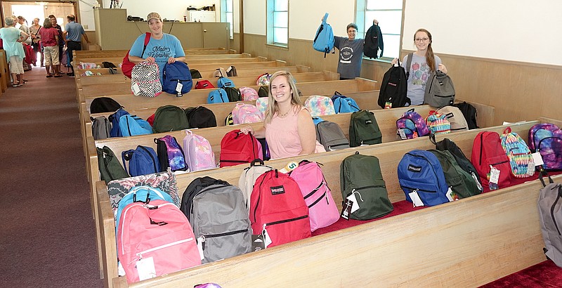 Adults who are helping put Piney Grove Baptist Church's free backpack program into action are, from left, Erin Coats, Carly Powell, Tommie Finley and LaVon Francis.
