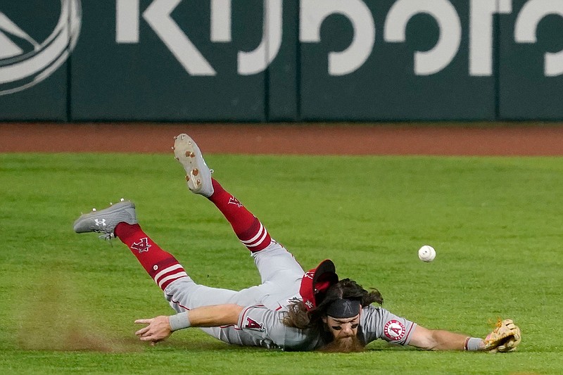Los Angeles Angels center fielder Brandon Marsh is unable to catch an RBI single by Texas Rangers' Curtis Terry during the second inning of a baseball game in Arlington, Texas, Tuesday, Aug. 3, 2021. (AP Photo/Tony Gutierrez)