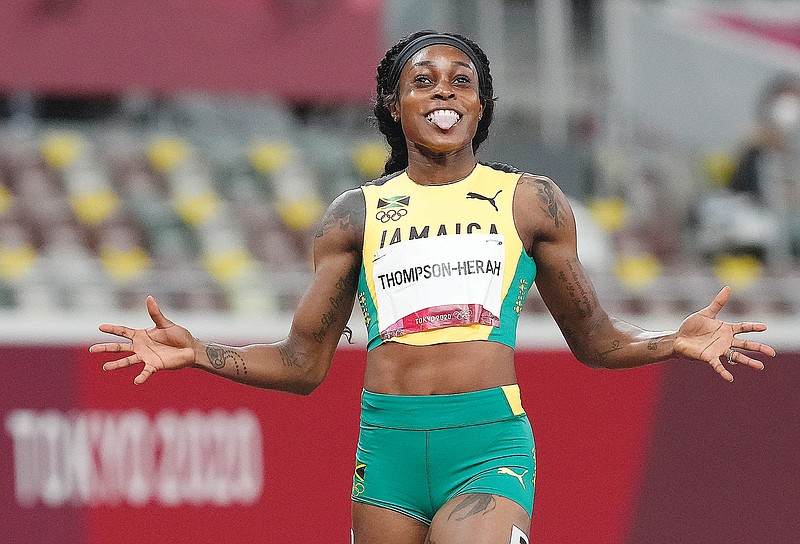 Elaine Thompson-Herah of Jamaica smiles Tuesday after winning the gold medal in the women's 200-meter dash at the 2020 Summer Olympics in Tokyo.