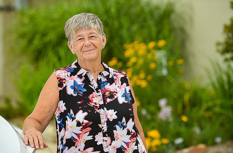 Deb Rademan poses at the greenhouses in north Jefferson City, where she served as manager of the Central Missouri Master Gardeners Greenhouses. (Julie Smith/News Tribune)