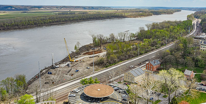 In this July 8, 2021 News Tribune photo, work continues on Adrian's Island as crews remove trees and prepare for concrete to be poured for the Bicentennial Bridge along the Missouri River in Jefferson City.