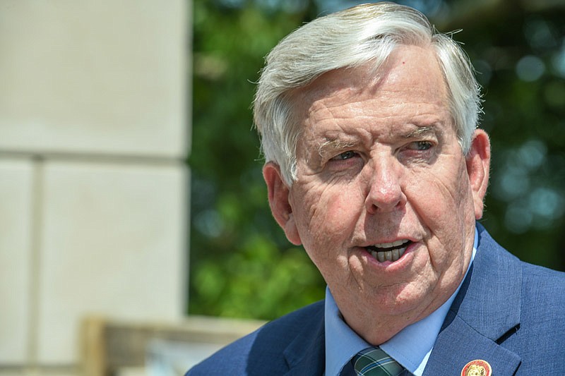 During a brief speech Aug. 9, 2021, to dedicate the pedestrian bridge leading to Adrian's Island, Missouri Gov. Mike Parson congratulates the Bicentennial Bridge Commission for hard work bringing the concept to reality 