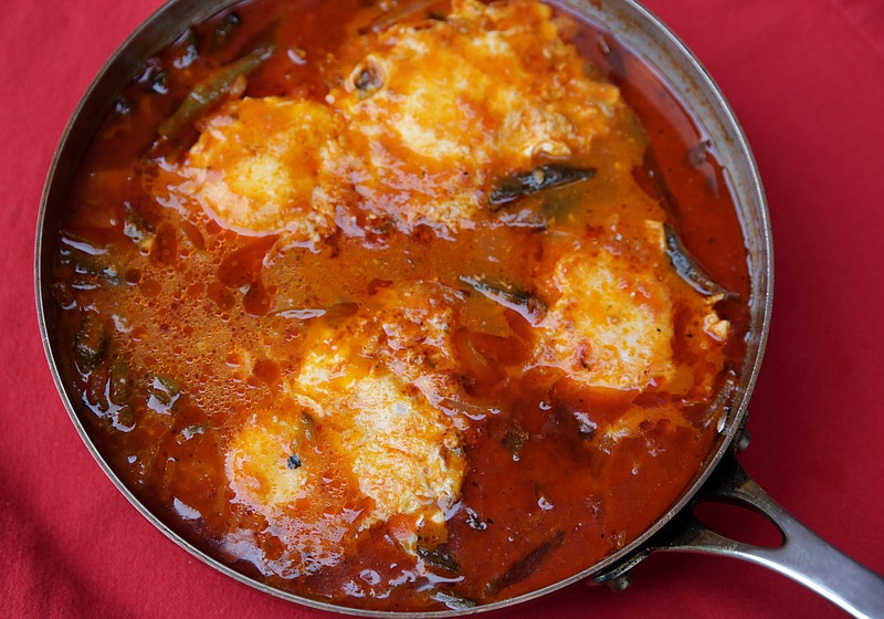 Eggs Poached in a Chile-Tomato Broth, a recipe with peppers, Wednesday, July 14, 2021. (Hillary Levin/St. Louis Post-Dispatch/TNS)