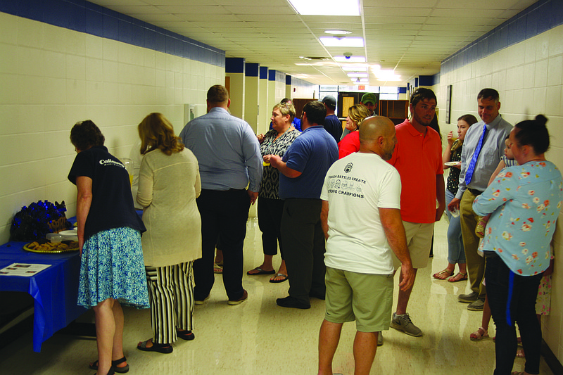 Attendees of the South Callaway school board meeting on Wednesday took a break for punch and cookies. During this time, the seven new teachers could mingle with their coworkers before the rest of the meeting's agenda was addressed.