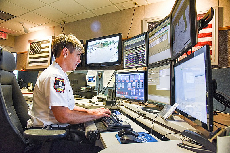 Jefferson City Emergency Dispatcher Angie Stiefermann pays close attention as she takes a call. The 911 Call Center servicing Jefferson City and Cole County will be updated in the coming months. (Julie Smith/News Tribune)