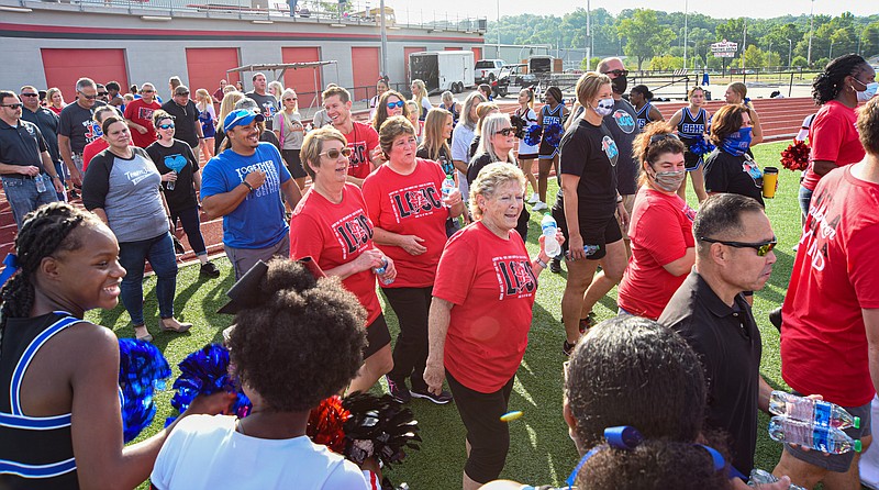 Julie Smith/News Tribune
Jefferson City School District faculty and staff enter the field at Adkins Stadium Friday during the opening session celebration.