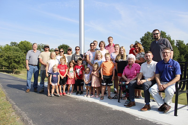 <p>Democrat photo/Austin Hornbostel</p><p>Much of the Burger clan was on hand — joined by City of California Park Supervisor Robert Pace, California Mayor Rich Green and other city workers — last week as the E.M. Burger Foundation commemorated the installation of a new, towering flag pole at Proctor Park.</p>