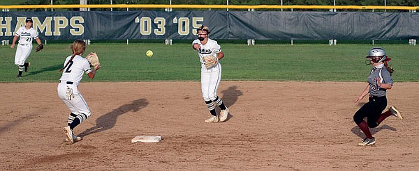 Helias second baseman Payton Dudenhoeffer flips the ball to shortstop Ella Meyer for a forceout during a game against Rolla last season at the American Legion Post 5 Sports Complex.