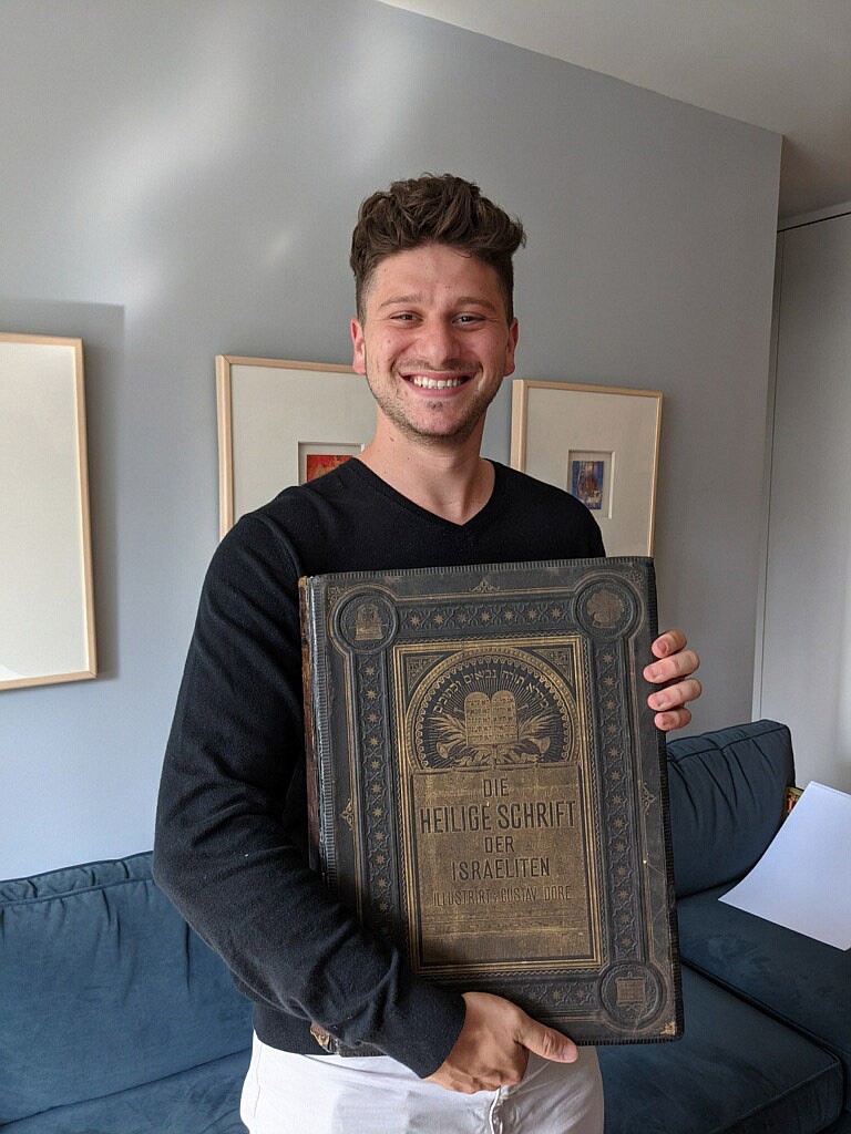 Jacob Leiter holds the Bible belonging to his great-great-grandparents. (Jenna Tamborski)