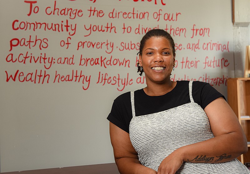 Alicia Edwards poses at Building Community Bridges, a local non-profit where she serves as executive director.