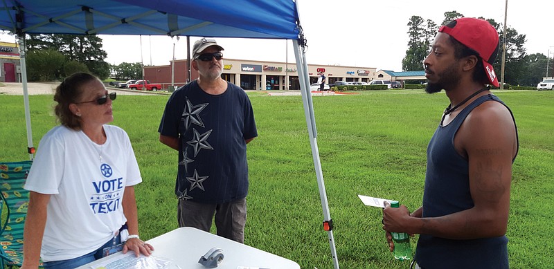 Nancy Platt of Texas Nationalist Movement, along James Lowry, explain their group's position and efforts to gather signatures in support of Texas independence. 