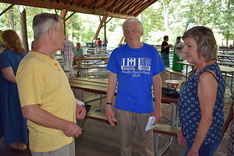 Gerry Tritz/News Tribune
First Presbyterian Church Associate Pastor Dave Henry (middle) is flanked by Larry and Pattie Burkhardt at Henry's retirement ceremony at Memorial Park Sunday afternoon. Dozens of well-wishers came to say goodbye to the long-time pastor.