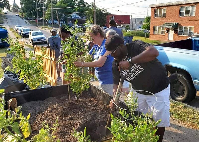 (Courtesy of Jennifer Ferguson) Community members learn about pallet gardening and compost July 17 at Ubuntu Community Garden’s monthly event. Classes are free of charge and are often hosted at Ubuntu Garden’s home site at 212 East Ashley Street.