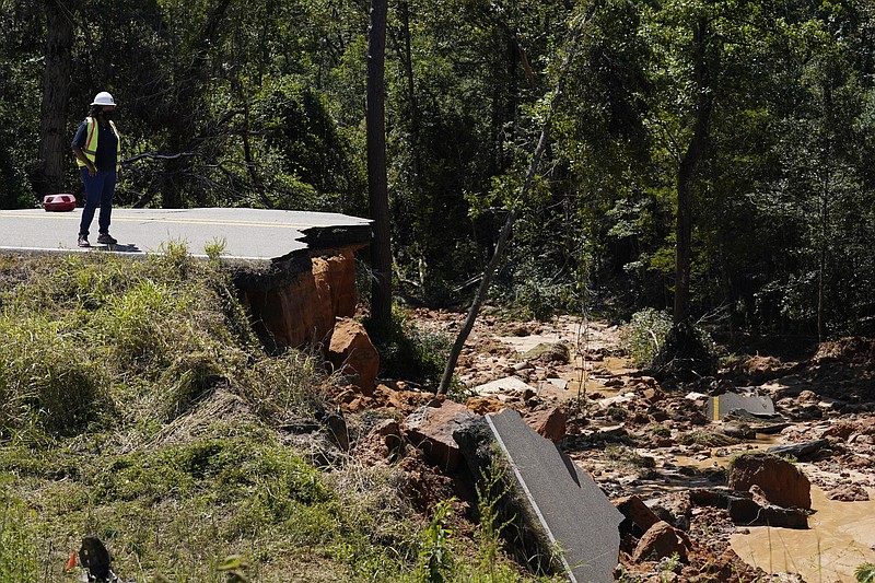 Cars plunge into hole after road collapses