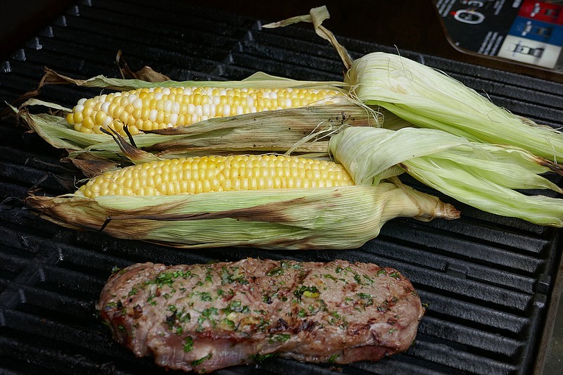 Stuffed steak and grilled corn on the cob. (Linda Gassenheimer/TNS)