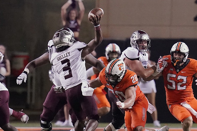 Missouri State quarterback Jason Shelley passes under pressure from Oklahoma State linebacker Malcolm Rodriguez in the second half of Saturday night's game in Stillwater, Okla.