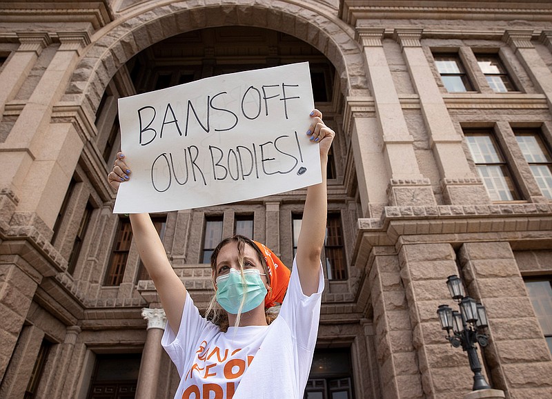 In this Sept. 1, 2021, file photo, Jillian Dworin participates in a protest against the six-week abortion ban at the Capitol in Austin, Texas. Young people on social media have found a way to protest Texas' new law banning most abortions by focusing on a website established by the state's largest anti-abortion group that takes in tips on violations.(Jay Janner/Austin American-Statesman via AP, File)