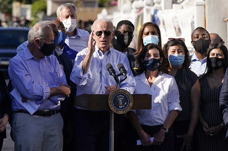 <p>President Joe Biden speaks as he tours a neighborhood impacted by flooding from the remnants of Hurricane Ida, Tuesday, Sept. 7, 2021, in the Queens borough of New York. (AP Photo/Evan Vucci)</p>