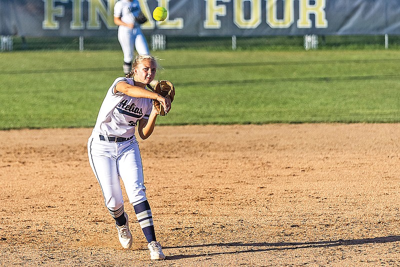 Helias third baseman Gabrielle Bax throws the ball to first base to try and get an out during Wednesday's game against Jefferson City at the American Legion Post 5 Sports Complex.