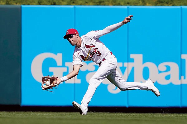 Cardinals center fielder Dylan Carlson catches a fly ball by Max Muncy of the Dodgers during the fifth inning of Thursday afternoon's game at Busch Stadium.