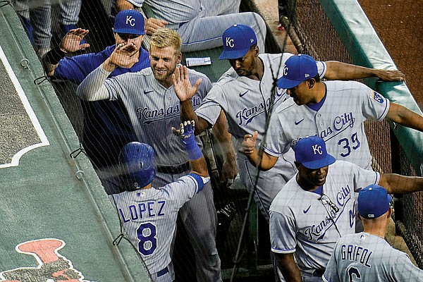 Nicky Lopez (left) is greeted in the Royals dugout after hitting a solo home run in the top of the first inning of Thursday night's game against the Orioles in Baltimore.