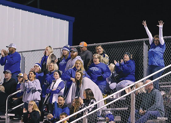 Russellville fans cheer during a home game last season against Harrisburg. Russellville will open its home schedule tonight against Sweet Springs.