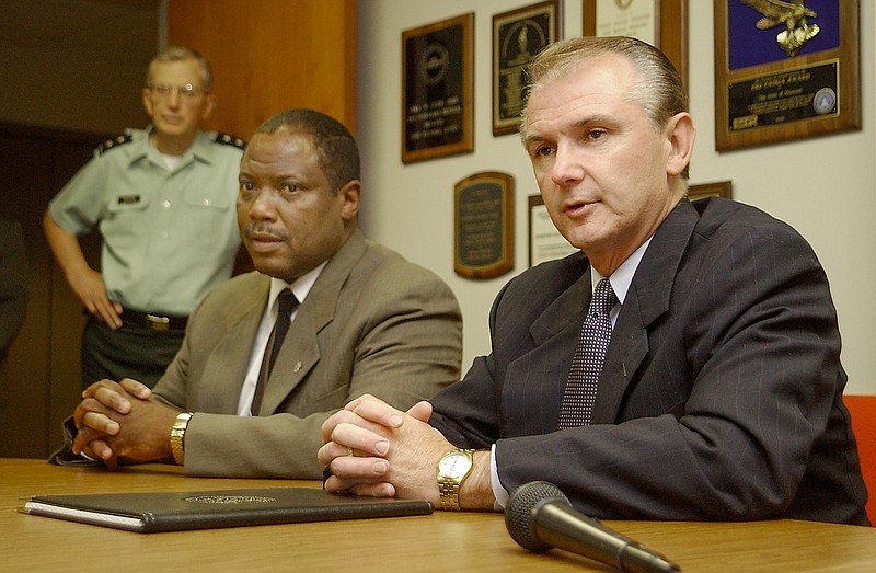 Missouri Adjutant General John Havens, left, and Director of Public Safety Charles Jackson, center, listen as Gov. Bob Holden responds to questions during a press conference Sept. 11, 2001, at Missouri National Guard Headquarters.  The conference was held in response to the terrorist attacks in New York and Washington D.C.