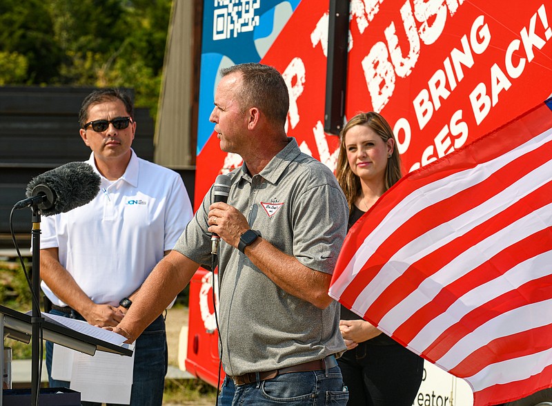 Julie Smith/News Tribune
DeLong's, Inc. General Manager Darrin Kelly addresses employees Friday during a visit by Job Creators Network staff to the Jefferson City plant. Standing in the background are Morgan DeLong Costello, co-owner and co-COO, and Alfredo Ortiz, president of JCN. The crew made a stop at the manufacturing  facility to talk about a number of business related items.