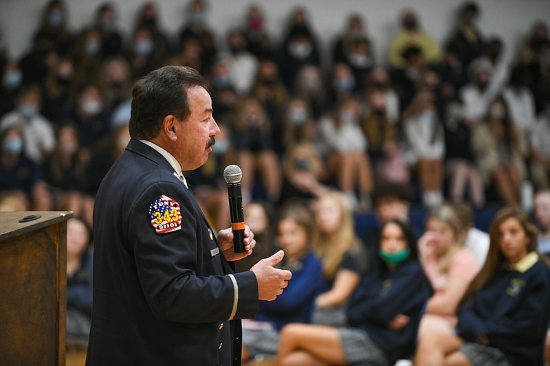 Joe Torrillo, former FDNY firefighter, spoke to students at Helias Catholic High School Thursday about life and education choices and how he ended up buried under rubble after the attacks on New York's Twin Towers on Sept. 11, 2001. Torrillo suffered many injuries and lost numerous colleagues while trying to rescue people in the towers. In addition to visiting several area high schools,  Torrillo will speak at Friday evening's Patriot Day ceremony at the Capitol.