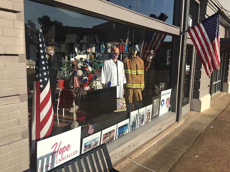 Main Street Texarkana and architect Herb Crumpton have put together a multi-media storefront display in observance of the 20th anniversary of the terrorist attacks at his office at 416 N. State Line Avenue near the Federal Building downtown.