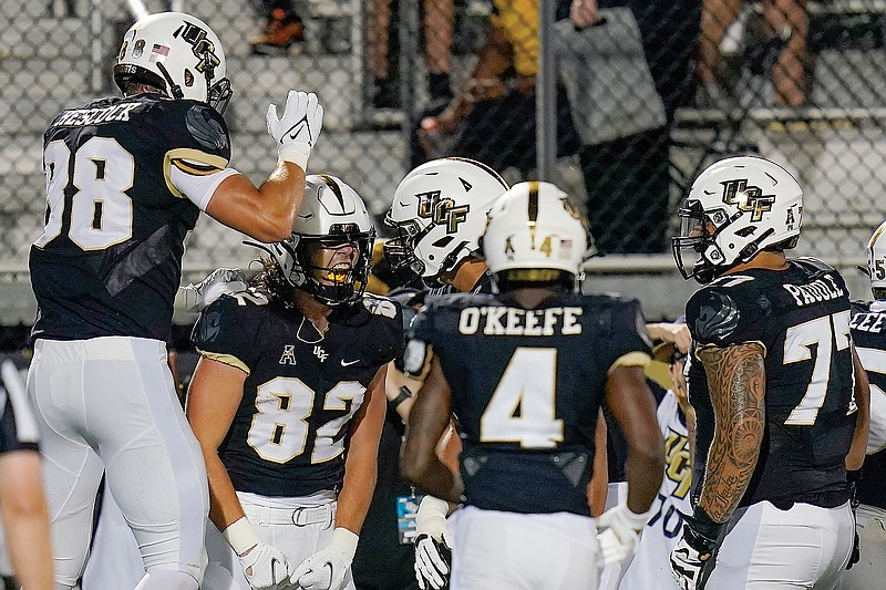 Central Florida tight end Alec Holler (82) celebrates his 23-yard touchdown reception with teammates during last Thursday's game against Boise State in Orlando, Fla.