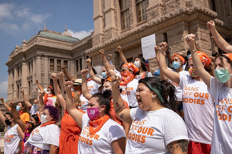 In this Sept. 1, 2021, file photo, women protest against the six-week abortion ban at the Capitol in Austin, Texas. The Texas abortion ban that so far has outmaneuvered Supreme Court precedent is the latest iteration of a legislative strategy used by Republican-led states to target pornography, gay rights and other hot-button cultural issues. But some are beginning to sound the alarm that the tactic of having enforcement done by citizens instead of government agencies could have a boomerang effect, pointing out that Democrats could use the same strategy on issues like gun control. (Jay Janner/Austin American-Statesman via AP, File)