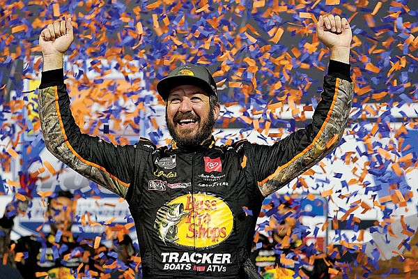 Martin Truex Jr. celebrates Saturday night after winning the NASCAR Cup Series race in Richmond, Va.