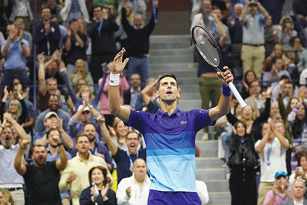 Novak Djokovic celebrates after winning the third set against Alexander Zverev in their U.S. Open semifinal match Friday night in New York.