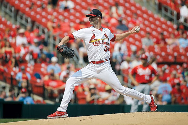 Cardinals starter J.A. Happ throws to the plate during Sunday afternoon's game against the Reds at Busch Stadium.