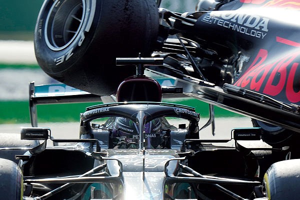 Lewis Hamilton crashes with Max Verstappen  during the Italian Formula One Grand Prix on Sunday  at Monza racetrack in Monza, Italy.