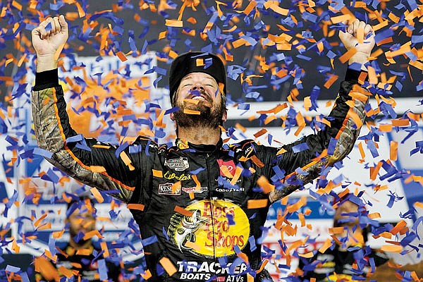 Martin Truex Jr. celebrates Saturday night after winning the NASCAR Cup Series race in Richmond, Va.