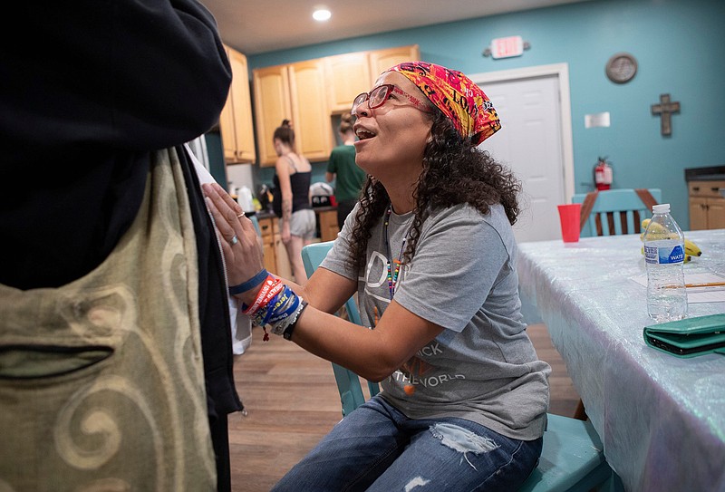 Esther Flores' passion and compassion for the women and girls she serves through her nonprofit group 1DivineLine2Health has garnered the registered nurse much admiration in the community. (Adam Cairns/Columbus Dispatch/TNS)