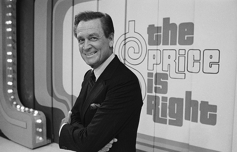 Television host Bob Barker appears on the set of his show, 'The Price is Right' in Los Angeles on July 25, 1985. The longest-running game show in television history is celebrating it's 50th season. (AP Photo/Lennox McLendon, File)