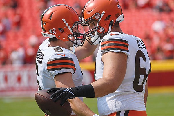 Browns quarterback Baker Mayfield (left) greets center JC Tretter during pre-game warmups before Sunday's game against the Chiefs at Arrowhead Stadium.