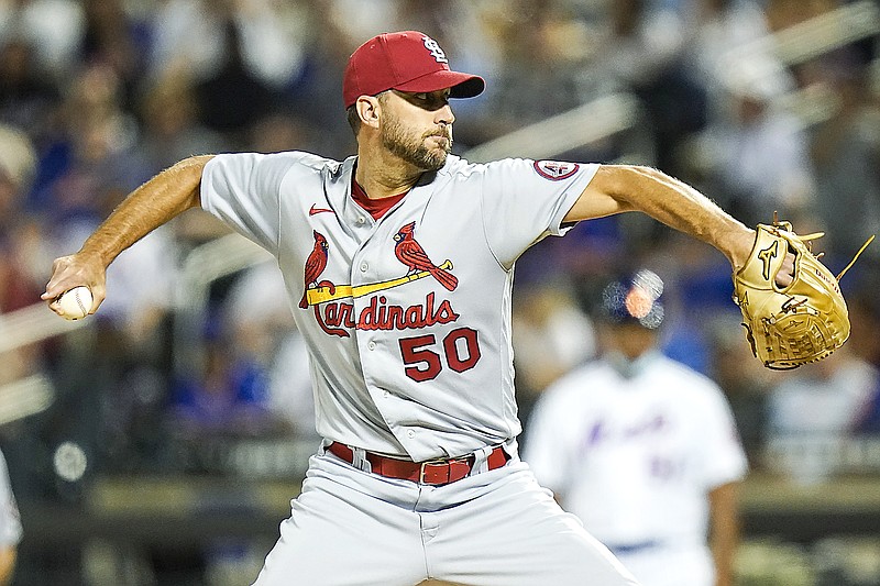 Adam Wainwright of the Cardinals delivers a pitch during Monday night's game against the Mets in New York.