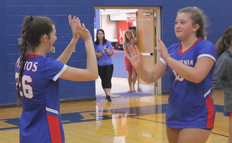 <p>Democrat photo/Evan Holmes</p><p>Lady Pintos teammates Ella Bailey and Penelope Cotten high five each other before Monday night’s match.</p>